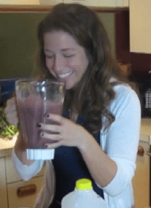 smiling while testing the double green smoothie