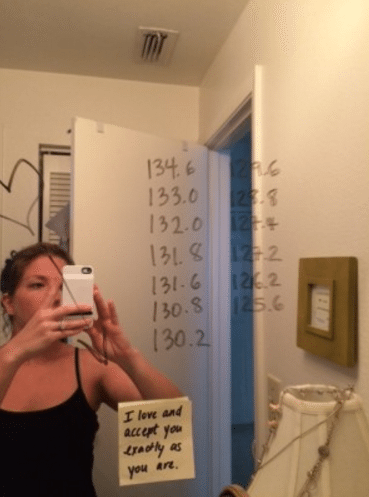 bathroom mirror with weights in dry erase marker