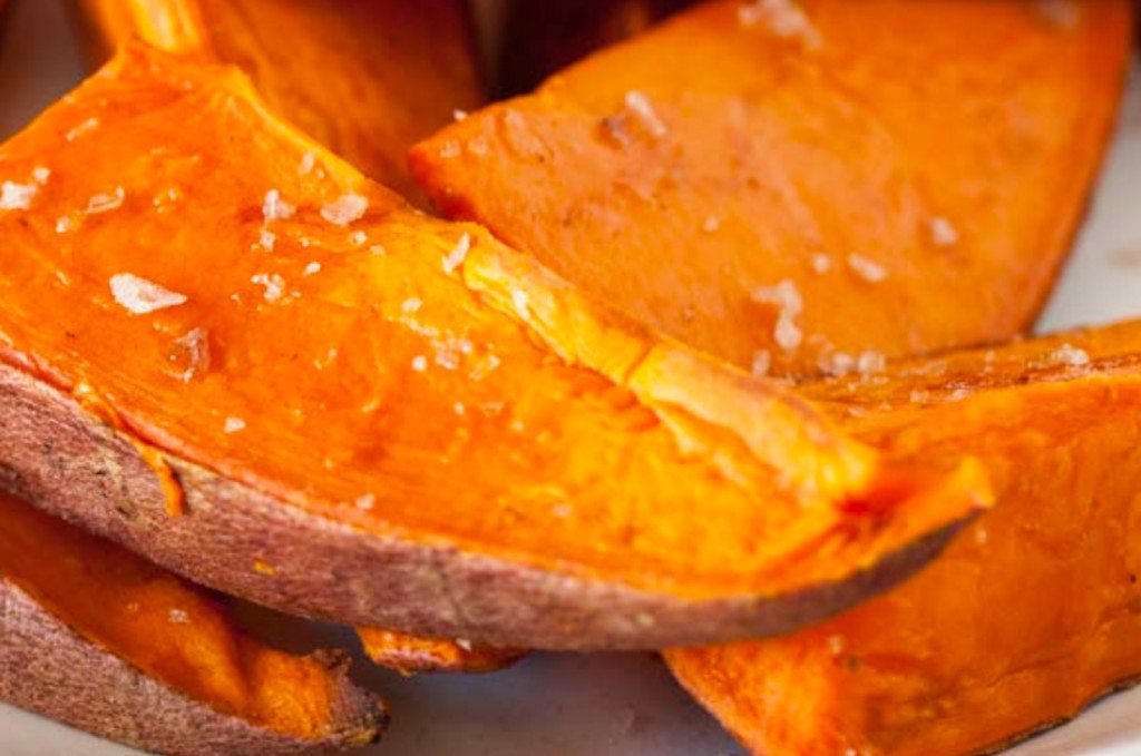 closeup image of baked sweet potato spears