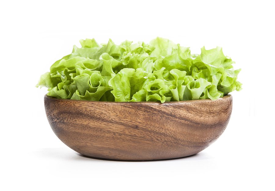 Fresh lettuce isolated on white background. Salad in a dish on a white background. Lettuce on a white background
