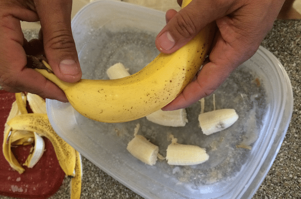 my husband peeling our bananas